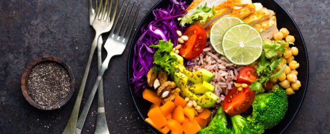 A bowl of vibrant veggies and rice.
