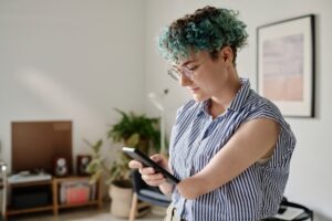 A woman looking at her phone.
